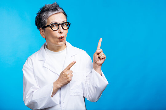 Scientist with lab coat and glasses pointing up, expressing surprise and excitement on a blue background