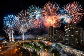 Obraz premium Fireworks over a waterfront city at night