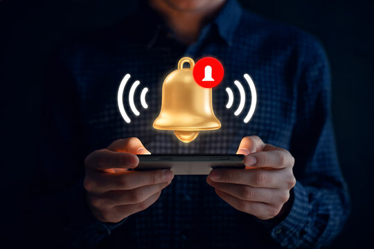 Person holding smartphone Notification bell icon with red dot appears above screen Alert reminder message urgent important