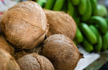 Fresh coconuts and green bananas © ProShine Studio