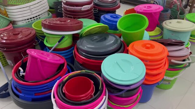 Colorful Plastic Buckets and Basins Stacked at Traditional Retail Store