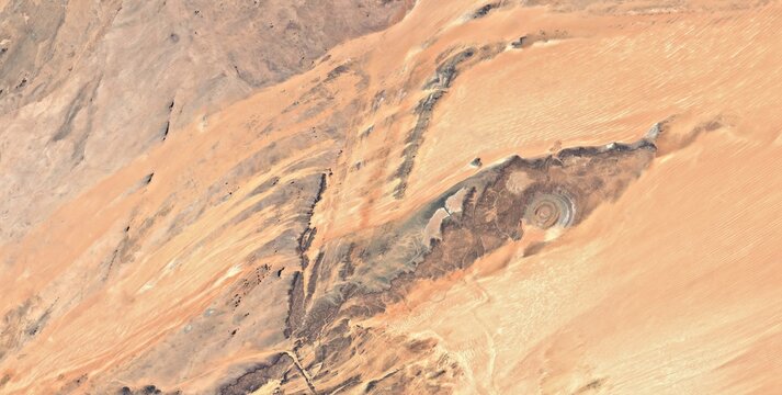 Satellite view of the concentric rock rings of the Richat Structure in Mauritania showing the eroded geological dome up close.