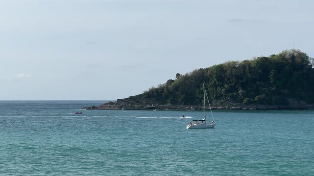 San Sebastian La Concha Bay Sailboat Sunny Day Headland View 4K Video 60fps