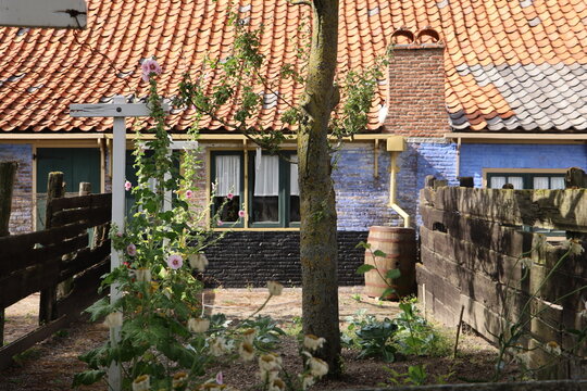 A traditional blue fisherman&rsquo;s house in a historic Dutch village with authentic architecture and a peaceful atmosphere. The building reflects the maritime heritage of North Holland and traditional coa