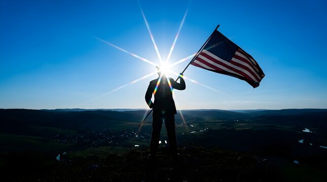 Businessman stands with an American flag under a bright glowing morning sun.
