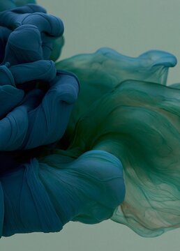 Abstract digital art piece that appears to be made up of different shades of blue and green. the blue is on the left side of the image, with the green on the right side.