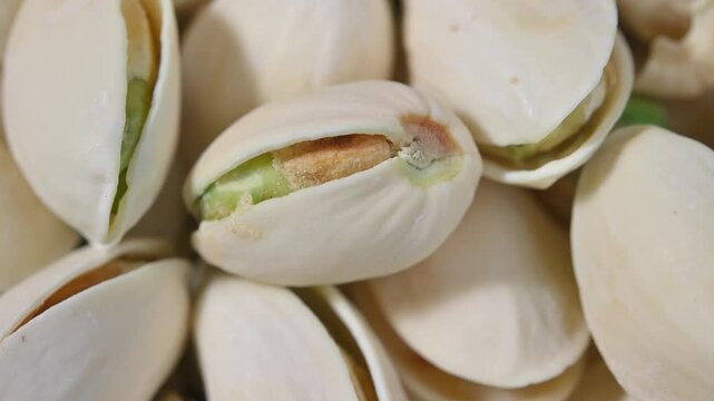 Close-up of roasted pistachios with natural texture and crunchy appearance. Healthy nut snack suitable for food, nutrition, and healthy lifestyle concepts.