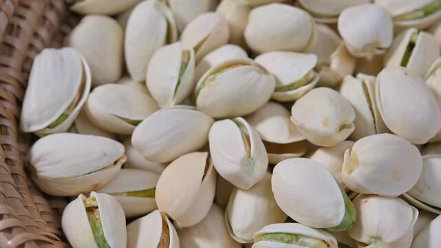 Close-up of roasted pistachios with natural texture and crunchy appearance. Healthy nut snack suitable for food, nutrition, and healthy lifestyle concepts.