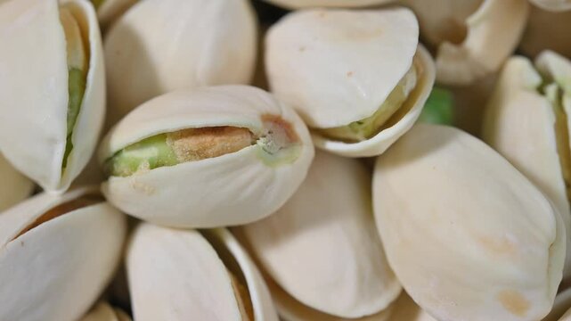 Close-up of roasted pistachios with natural texture and crunchy appearance. Healthy nut snack suitable for food, nutrition, and healthy lifestyle concepts.