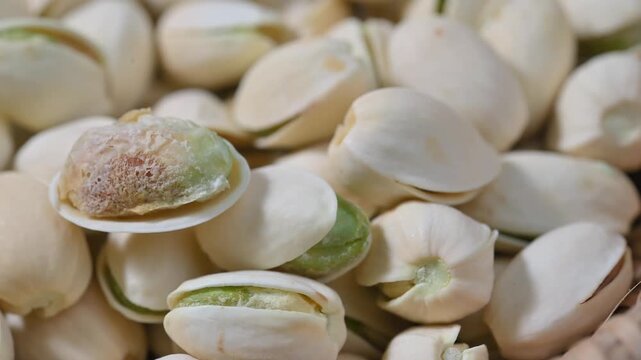Close-up of roasted pistachios with natural texture and crunchy appearance. Healthy nut snack suitable for food, nutrition, and healthy lifestyle concepts.