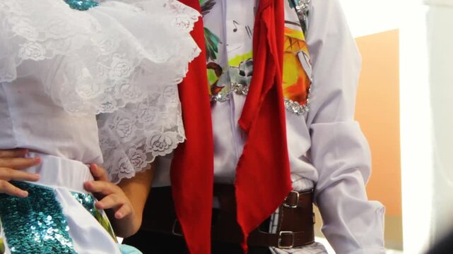 A pair of Colombian children are dressed in traditional attire during a cultural show at the San Juan and San Pedro Festival in Neiva, Huila, Colombia. Concept of Colombian culture