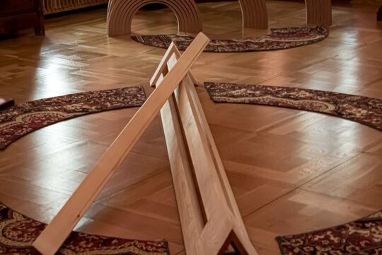 Abstract wooden installation on a parquet floor