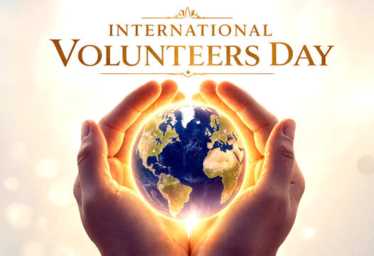 Caring hands holding a glowing earth for international volunteers day celebration concept
