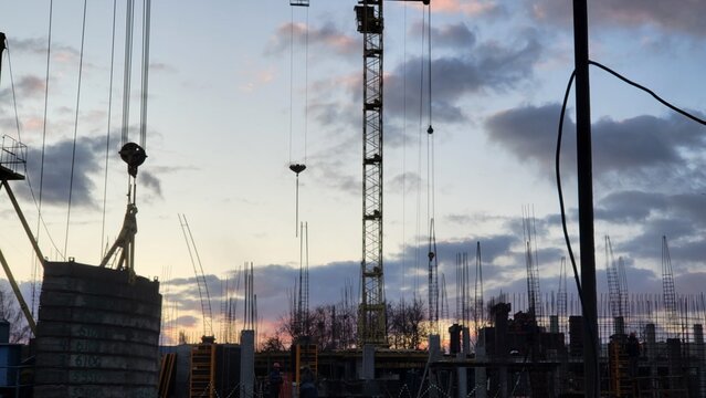 Construction site with crane during sunset in a city area