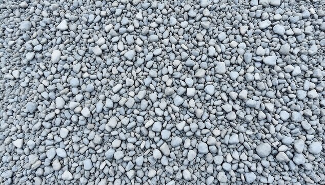 Top down view of uniform small gray gravel stones covering the ground
