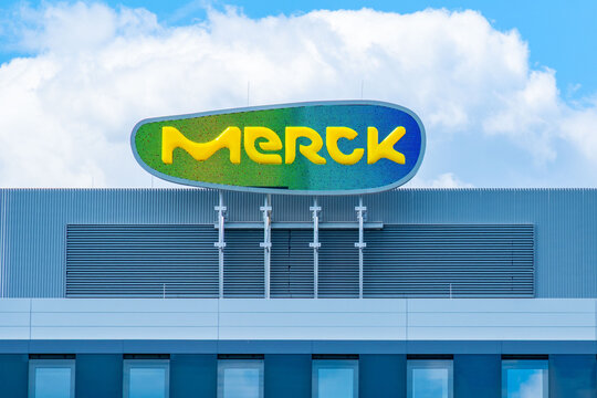 corporate Merck Group building facade, pharmaceutical headquarters architecture, Merck KGaA biotechnology company, science branding industry, Healthcare business infrastructure, Darmstadt, Germany