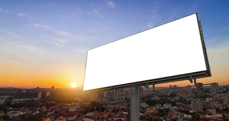 Fototapeta premium Blank White Billboard Mockup on Modern City Skyline Background Sunset