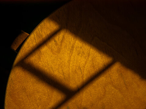 Golden Window Shadow Pattern on Wooden Surface, Warm Light and Shade Abstract Texture
