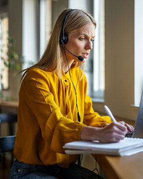 Customer service operator working from home assisting clients