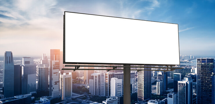 Blank White Billboard Mockup on Modern City Skyline Background Sunset