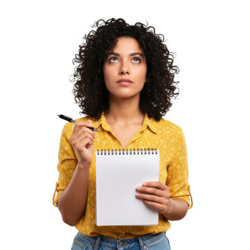 Young woman holding a notepad and pen, looking thoughtful and creative.