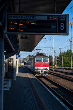 Poprad, Slovakia - July 25, 2026: Passenger train arriving at Poprad-Tatry railway station platform.