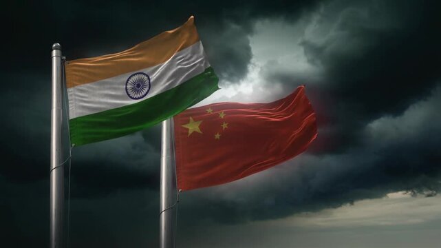 Indian and Chinese national flags waving together against dramatic stormy sky symbolizing international relations and diplomacy