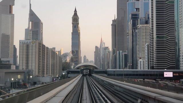 Modern cityscape with towers and tracks in Dubai during early morning