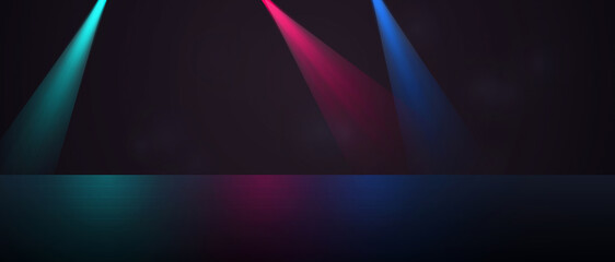 Obraz premium Three vibrant spotlights in teal, pink, and blue illuminating a dark stage with reflective floor