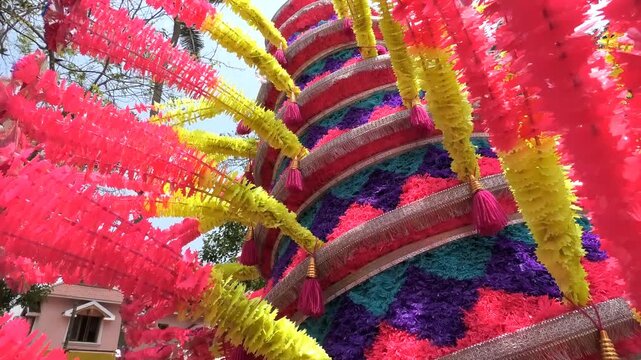 Closeup of colorful spinning structures traditionally used in the 'Kavadi' procession of temple festivals in South India