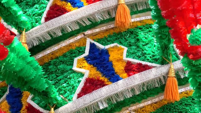 Closeup of colorful spinning structures traditionally used in the 'Kavadi' procession of temple festivals in South India