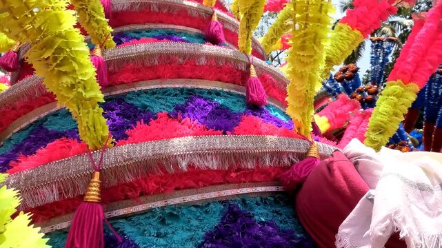 Closeup of colorful spinning structures traditionally used in the 'Kavadi' procession of temple festivals in South India