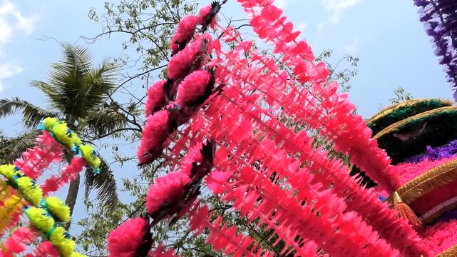 Closeup of colorful spinning structures traditionally used in the 'Kavadi' procession of temple festivals in South India