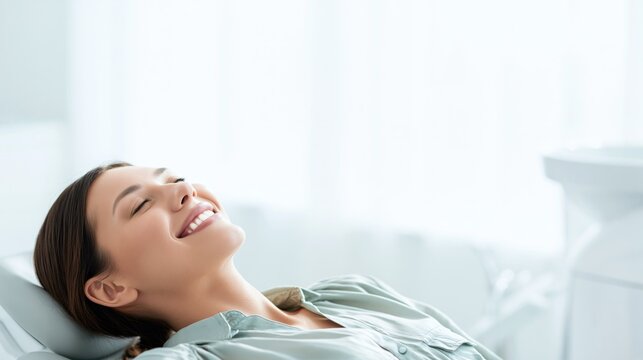 Happy woman resting at home. Relaxed female lying on bed enjoying peaceful quiet time.