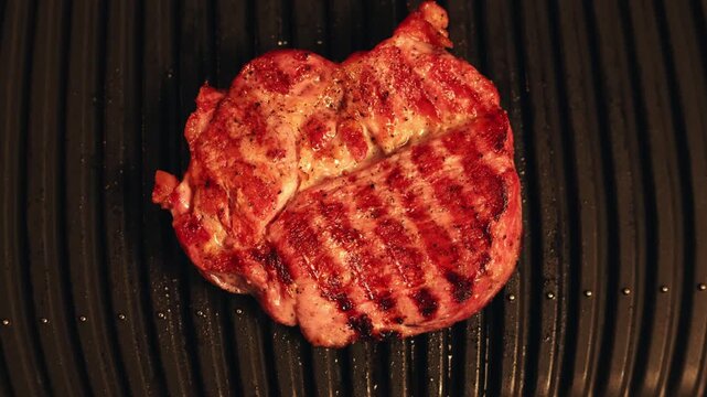 Juicy steak sizzling on a hot grill with perfect sear marks