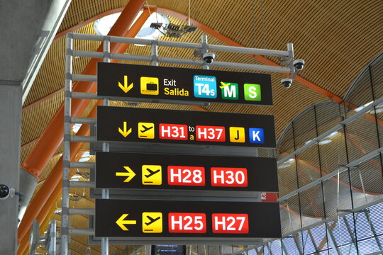 MADRID, SPAIN - JUNE, 28, 2026. Airport barajas madrid terminal signage and directional gate board with arrows for travel background and wayfinding design