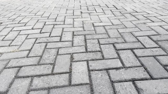Outdoor concrete brick pavement texture on spacious pedestrian zone