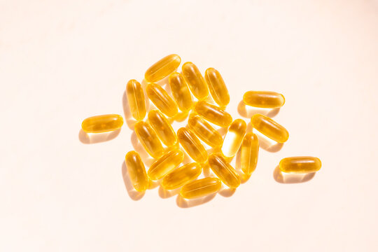 Omega 3 yellow gel capsules, vitamin d bg