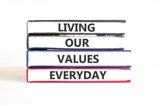 Living our values everyday words symbol. Concept words Living our values everyday on beautiful books. Beautiful white background. Business living our values everyday concept. Copy space.