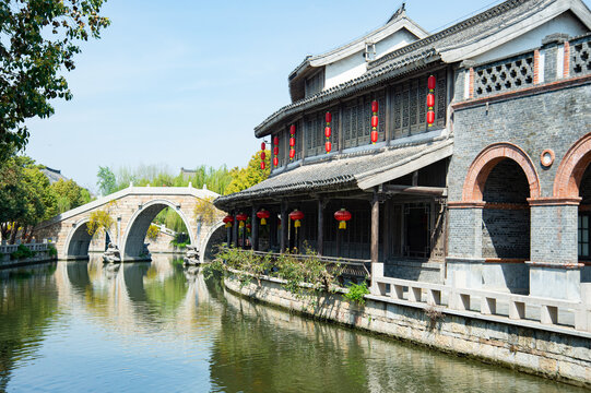 Traditional Chinese water town with stone arch bridge and red lanterns