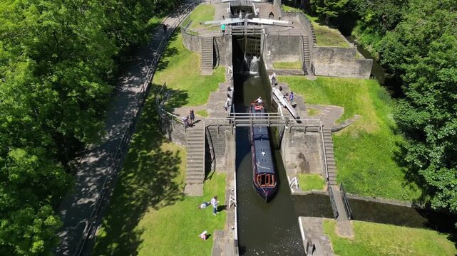 Aerial Drone footage of a Narrow Boat travelling through the famous Bingley Five Rise Locks