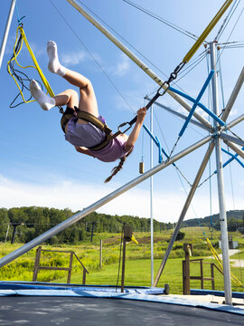Lifestyle girl jump bungee trampoline   Upside down