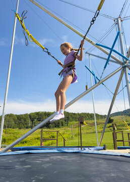 Lifestyle girl jump bungee trampoline   outside