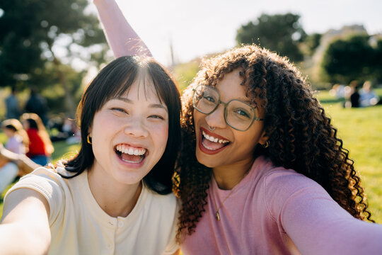Two women taking selfies