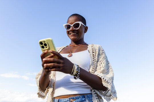 Black woman  Cell phone outdoors 