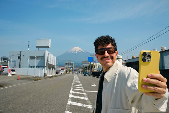 Man Taking Selfie on Street Near Mount Fuji in Shizuoka
