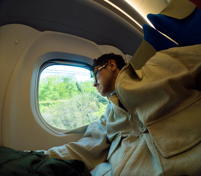 Man Resting on Shinkansen Bullet Train