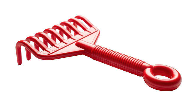 Red plastic toy rake isolated on transparent background