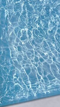 Abstract background Blue swimming pool water surface and ripple wave background. perfect for themes related to summer, vacation, purity