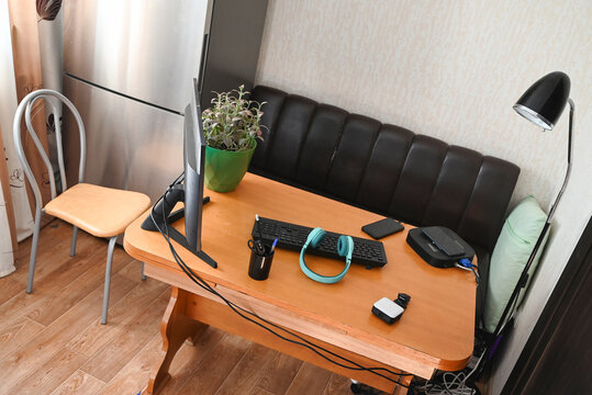 Indoor desk with computer and supplies